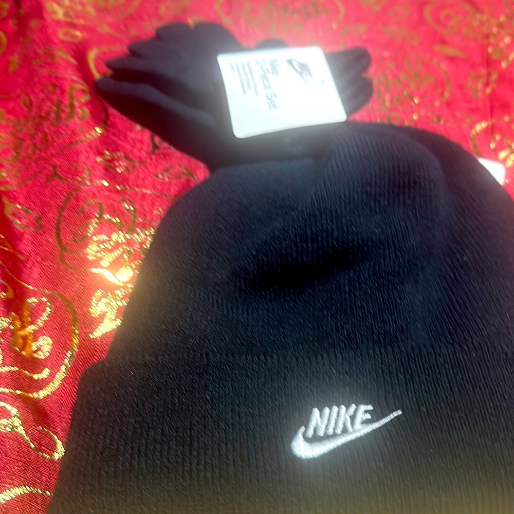 This black hat with matching gloves is Nike for youth, two piece,hat, and gloves